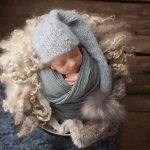 baby twins photographer Sussex newborn boy asleep knits wraps layers bobble hat studio portrait Samphire Photography