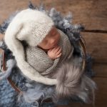 baby twins photographer Sussex newborn boy asleep blue grey knits wraps layers bobble hat studio portrait Samphire Photography