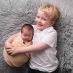 newborn baby shoot studio portrait with brother