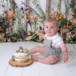 little boy in a floral woodland glade