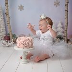 pretty winter wonderland for first birthday cake smash