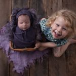 newborn baby with older sibling