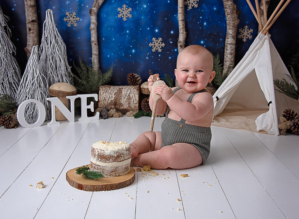 camping in the woods theme cake smash photographer surrey