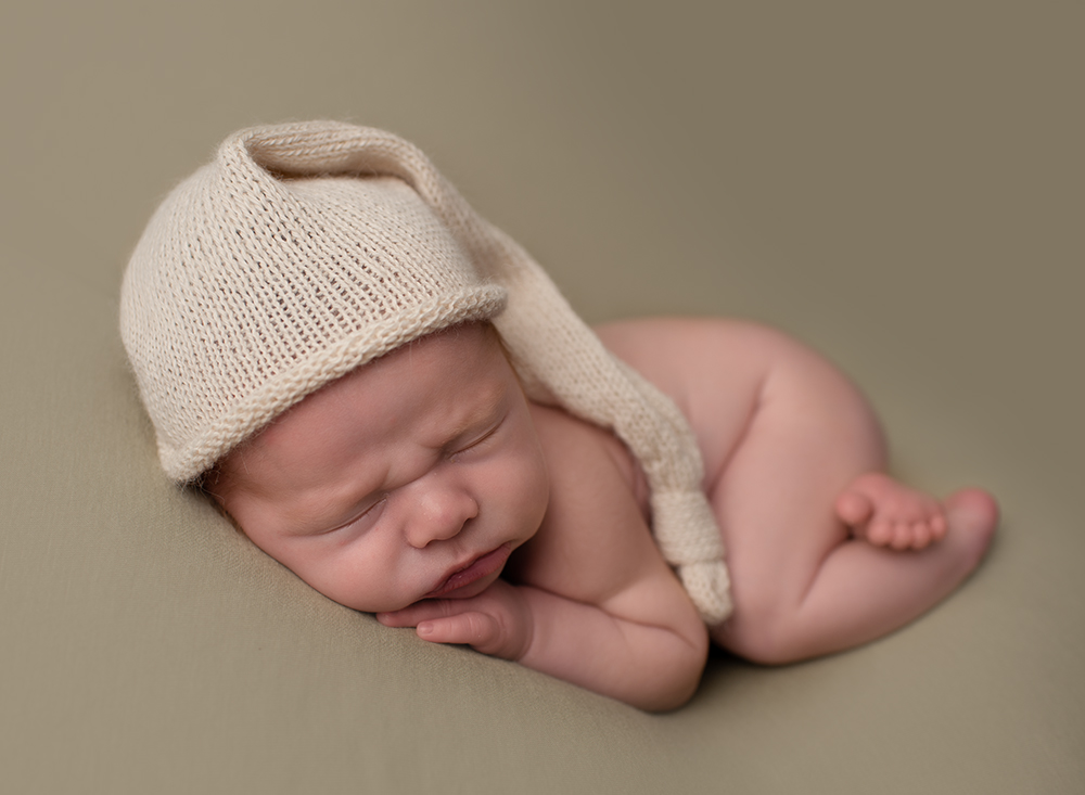 Baby boy sleeping with cute hat by Newborn Photographer Southwater Samphire Photography covering Crawley Down