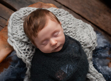 swaddled baby boy asleep
