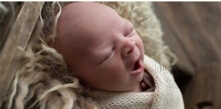 Baby born yawning at his horsham newborn photographer session with Samphire Photography