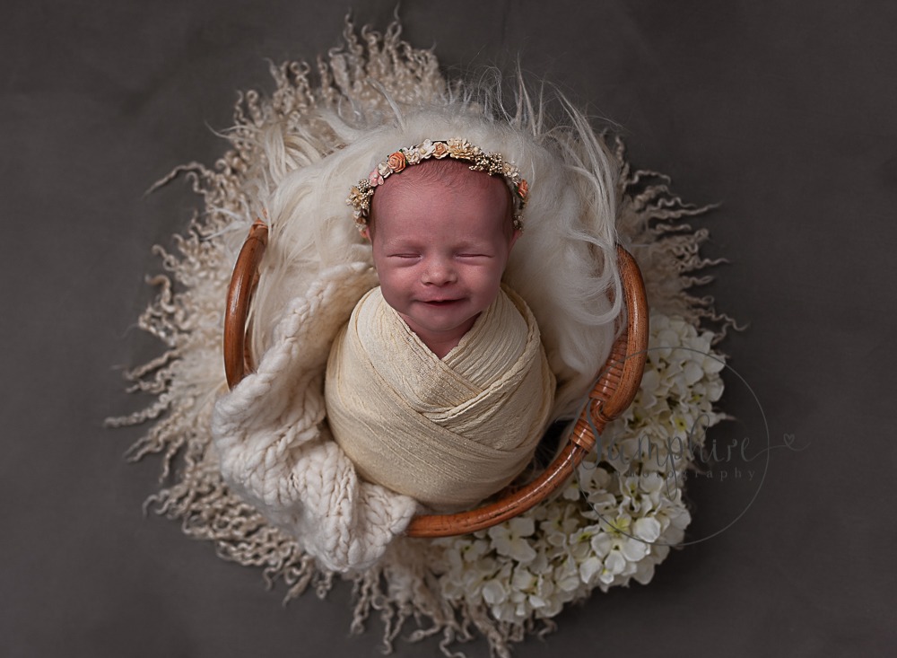 smiling baby asleep floral headband