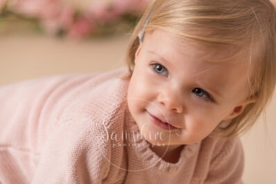 Cake Smash little girl close-up face pink photo sussex