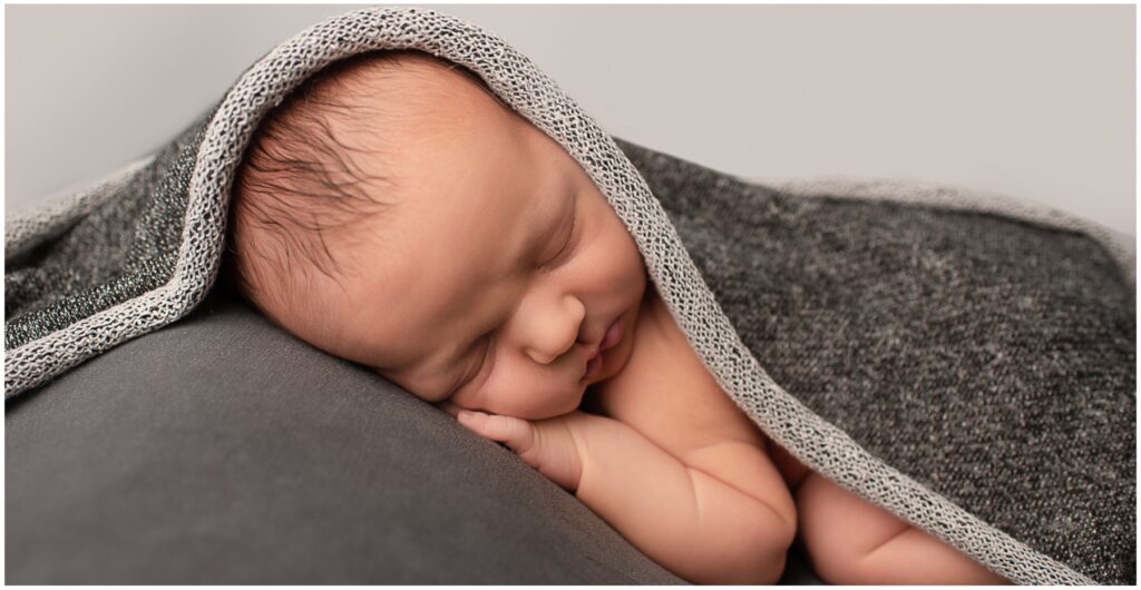 Newborn Photographer Henfield baby boy asleep grey background Samphire Photography
