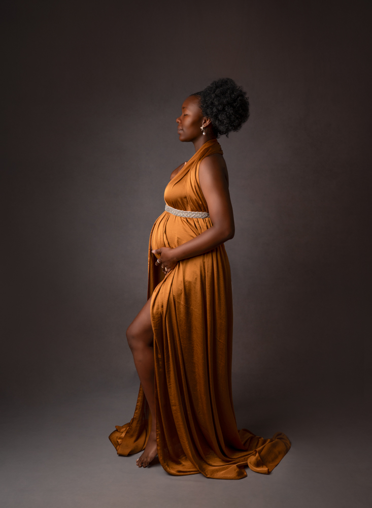 stunning mum to be in gold gown at maternity portrait session