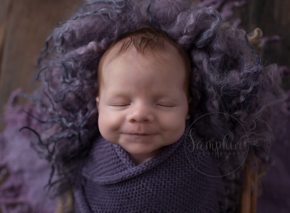 Cheesy smile from newborn baby girl in Horhsam