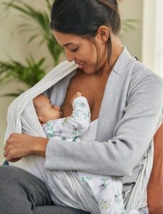 Mum nursing her baby under a scarf