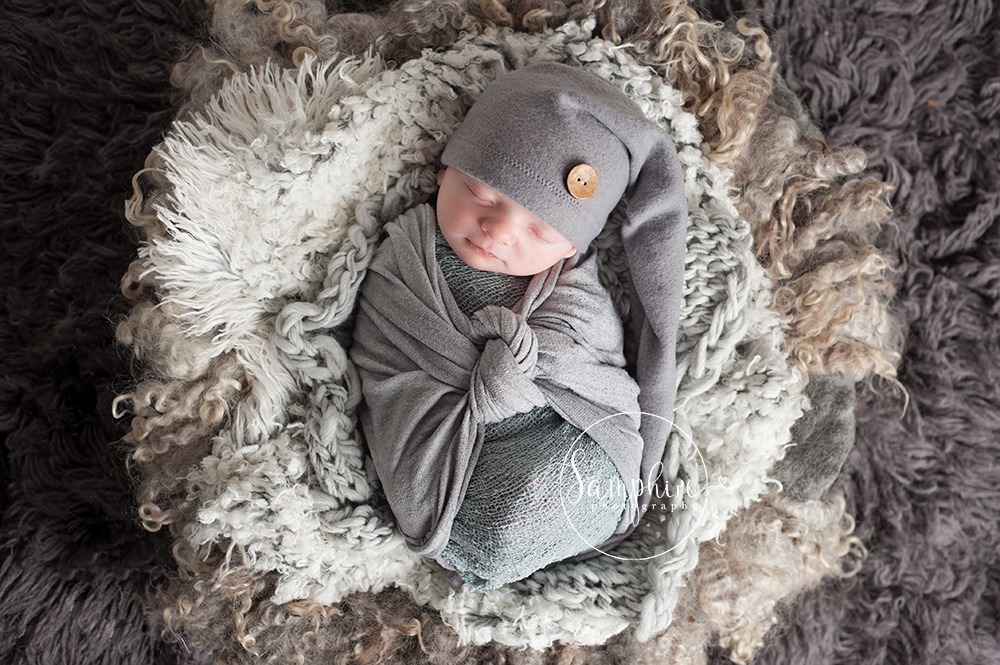 newborn boy portrait wrapped layers greys hat Samphire Photography baby safety temperature